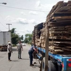 Unloading Lumber from a Barn Demolition